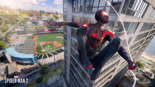 Miles Morales swinging through skyscrapers in Marvel's Spider-Man 2 free desktop wallpaper