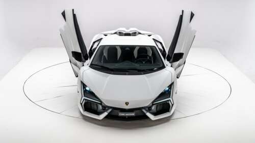 A high-resolution, close-up view of a white Lamborghini Revito supercar with a minimalist... free hd wallpapers