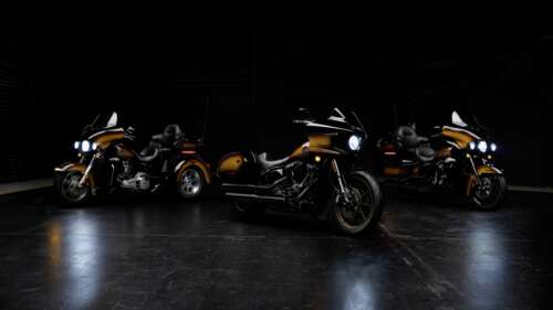 A cinematic, high-detail shot of a Harley-Davidson Low Rider motorcycle in a dark,... wallpaper