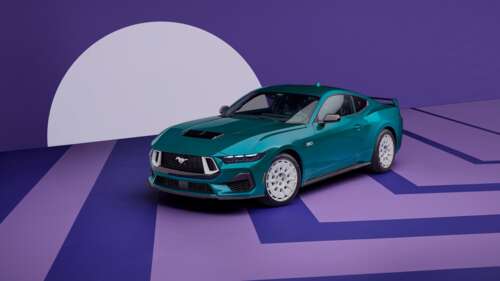 A sleek 2026 sports car featuring a futuristic aerodynamic design and a vibrant purple... wallpaper download