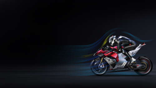A professional rider on an Ultraviolette F99 electric motorcycle against a dark,... free wallpaper