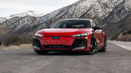 A sleek red 2025 Audi RS e-tron GT performance luxury electric car. wallpaper