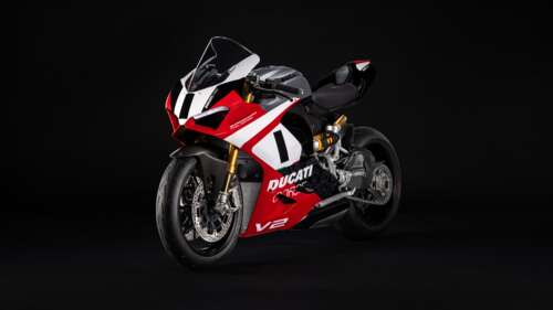 A cinematic studio shot of the 2025 Ducati Panigale V2 Final Edition motorcycle against... free background