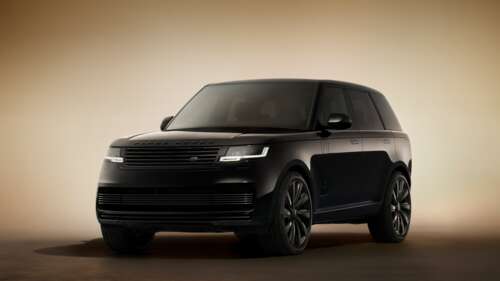 A sleek and polished 2025 Land Rover Range Rover Sport SVR in deep black color. wallpaper