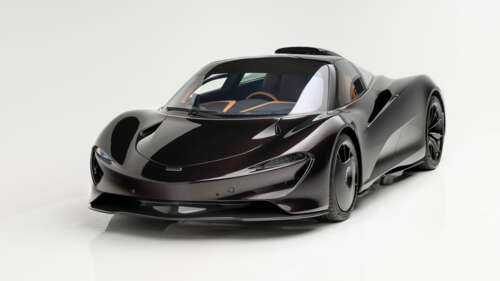 A sleek 2025 McLaren Speedtail hybrid sports car on a plain white background. high definition wallpaper