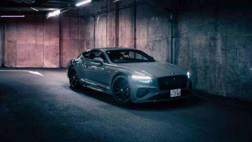 A luxury Bentley Continental GT Speed driving through a futuristic, neon-lit Japanese... pictures for wallpaper