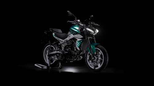 Close-up of detailed adventure motorcycles against a solid black background free hd wallpapers