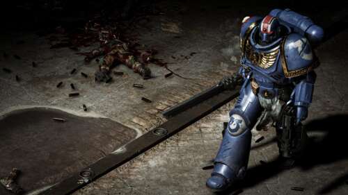 A fierce Space Marine in heavy combat power armor from the game Warhammer 40,000:... wallpaper