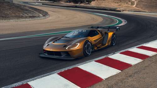 A high-performance Ford GT Mk IV supercar driving at high speed on a professional... Desktop high definition wallpaper