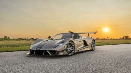 A detailed, cinematic view of the Hennessey Venom F5 Revolution hypercar, showcasing... free hd wallpapers