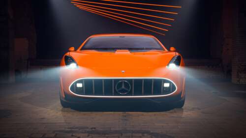 Close-up view of the futuristic headlights and front grille of the Mercedes-AMG GT... wallpaper