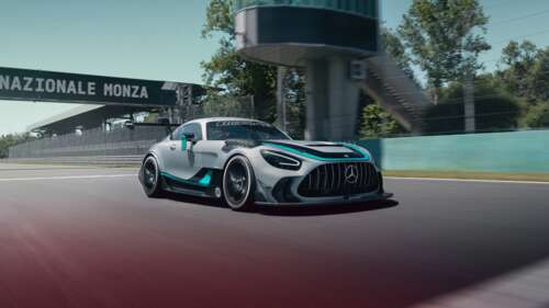 A sleek Mercedes-AMG GT2 Edition W16,5K racing car speeding through a corner on a... free hd wallpapers