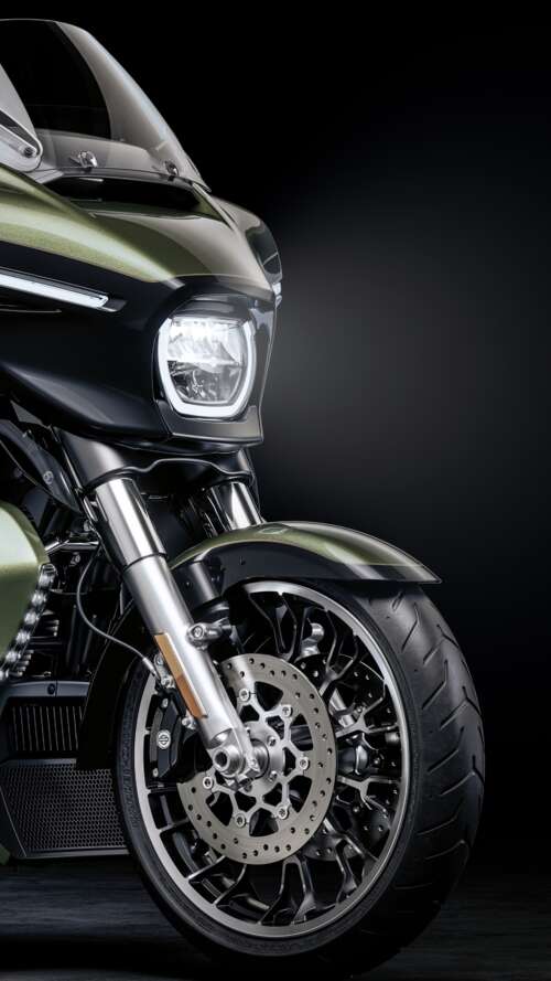 A high-detail view of a 2026 Harley-Davidson Street Glide cruiser motorcycle set... Apple iPhone SE 2022 wallpaper