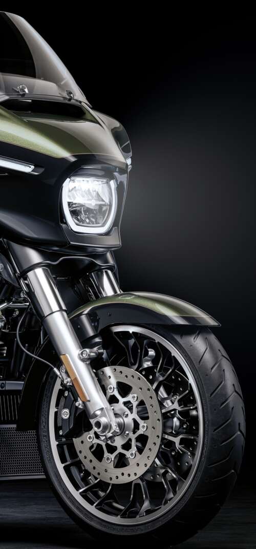 A high-detail view of a 2026 Harley-Davidson Street Glide cruiser motorcycle set... Samsung Galaxy S26 Ultra wallpaper photo gallery download