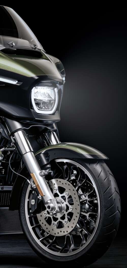 A high-detail view of a 2026 Harley-Davidson Street Glide cruiser motorcycle set... Oppo A6x 5G hand phone wallpaper