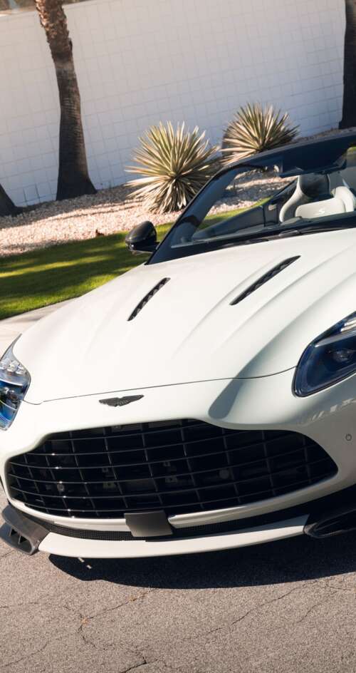 A high-resolution, detailed view of a luxury Aston Martin DB12 S Volante convertible... Sharp Aquos C10