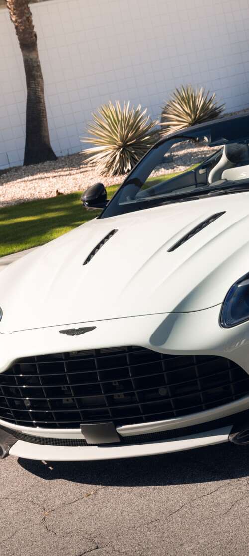 A high-resolution, detailed view of a luxury Aston Martin DB12 S Volante convertible... Motorola Moto G Stylus (2026) wallpaper