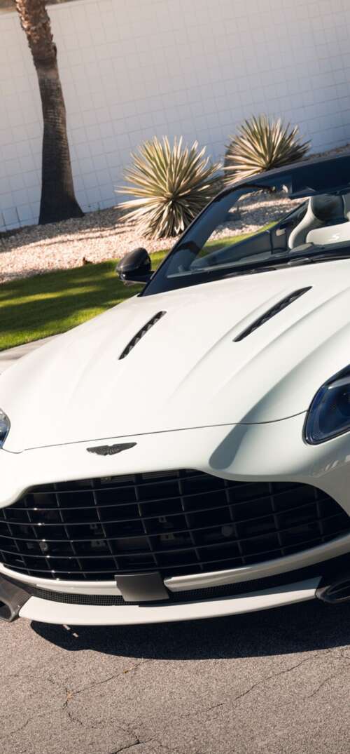 A high-resolution, detailed view of a luxury Aston Martin DB12 S Volante convertible... UmiDigi Umidigi X