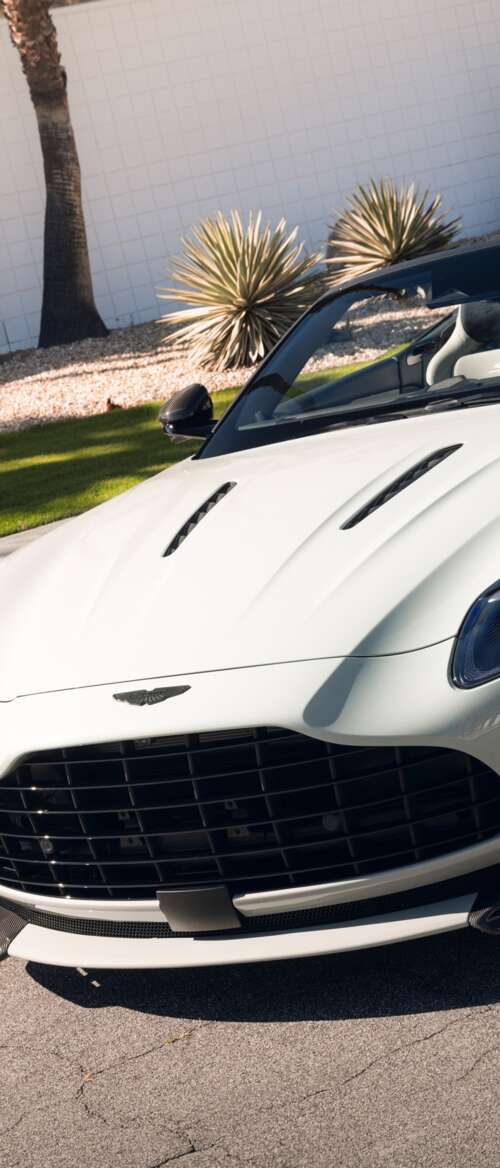 A high-resolution, detailed view of a luxury Aston Martin DB12 S Volante convertible... nubia Flip 3 hd background