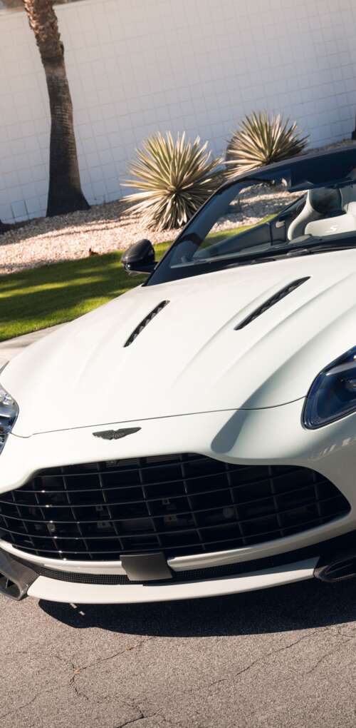 A high-resolution, detailed view of a luxury Aston Martin DB12 S Volante convertible... Huawei Mate 30 Pro