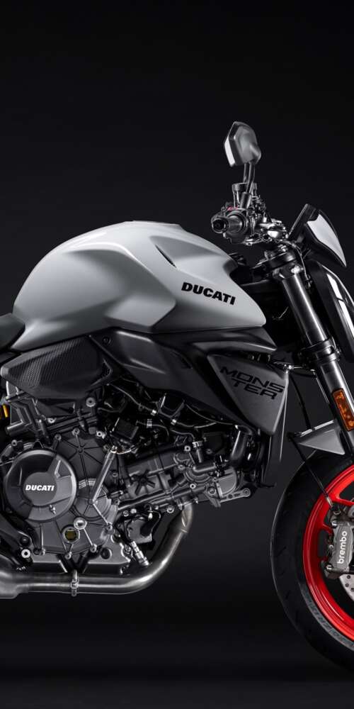 A high-detail shot of the 2026 Ducati Monster V2 sports motorcycle featuring a dark,... Ulefone Rugking 2 Pro wallpaper