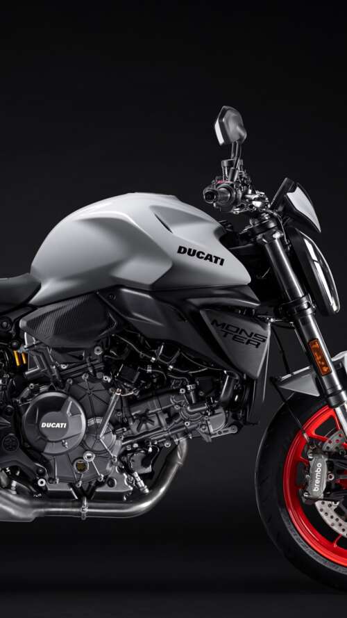 A high-detail shot of the 2026 Ducati Monster V2 sports motorcycle featuring a dark,... Apple iPhone SE 2022 wallpaper images