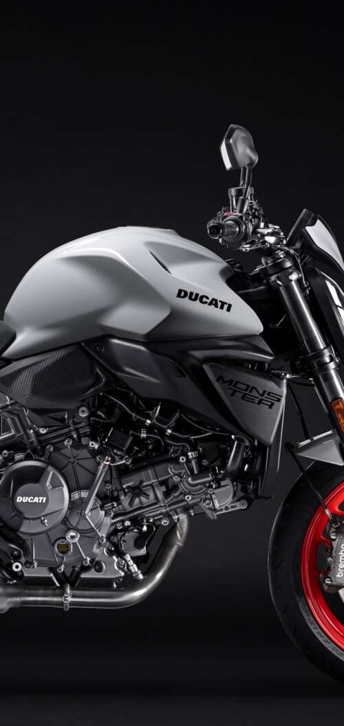 A high-detail shot of the 2026 Ducati Monster V2 sports motorcycle featuring a dark,... Oppo A6k 4G high definition wallpaper