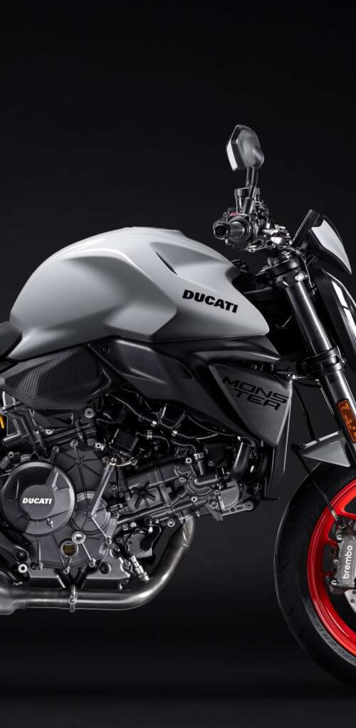 A high-detail shot of the 2026 Ducati Monster V2 sports motorcycle featuring a dark,... Huawei Mate 30 Pro wallpaper download