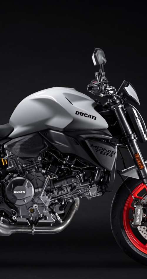 A high-detail shot of the 2026 Ducati Monster V2 sports motorcycle featuring a dark,... Sharp Aquos C10 wallpaper download