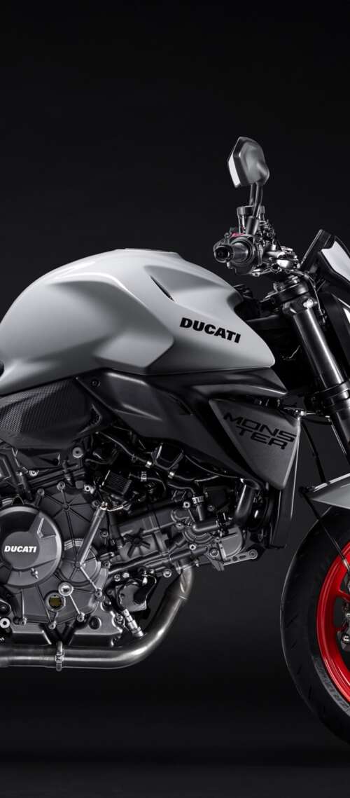 A high-detail shot of the 2026 Ducati Monster V2 sports motorcycle featuring a dark,... Xiaomi Redmi A7 Pro cell phone backgrounds free