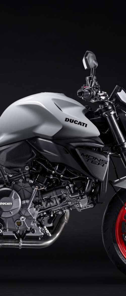 A high-detail shot of the 2026 Ducati Monster V2 sports motorcycle featuring a dark,... nubia Flip 3 download free phone wallpaper