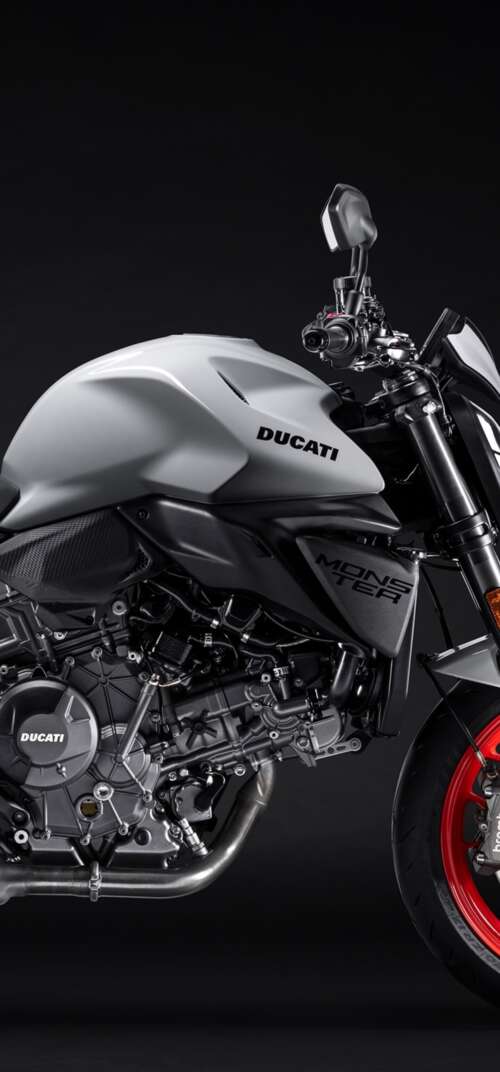 A high-detail shot of the 2026 Ducati Monster V2 sports motorcycle featuring a dark,... Samsung Galaxy S26 Ultra download free wallpaper for phone