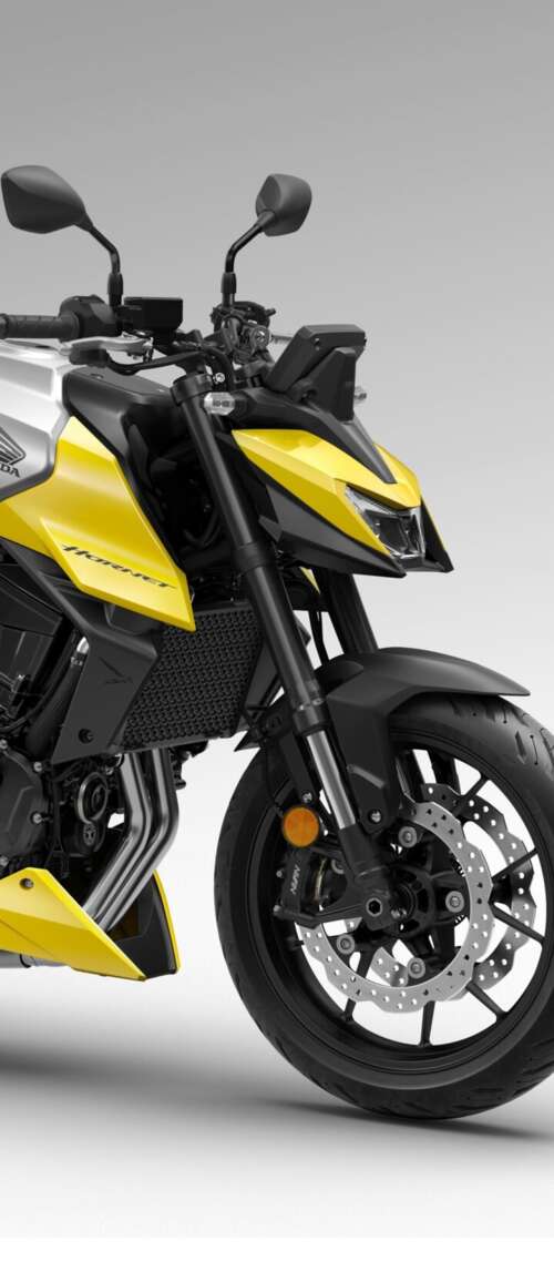 A detailed close-up of the futuristic 2026 Honda CB750 Hornet motorcycle showing... wallpaper