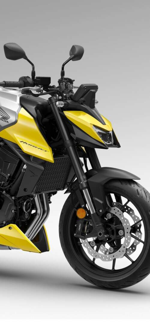 A detailed close-up of the futuristic 2026 Honda CB750 Hornet motorcycle showing... Oppo K13 Turbo wallpaper download