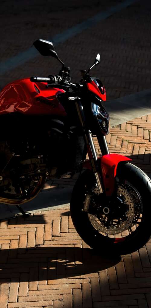 A sleek and aggressive 2026 Ducati Monster V2 motorcycle featuring modern sports... Huawei Mate 30 Pro free background images