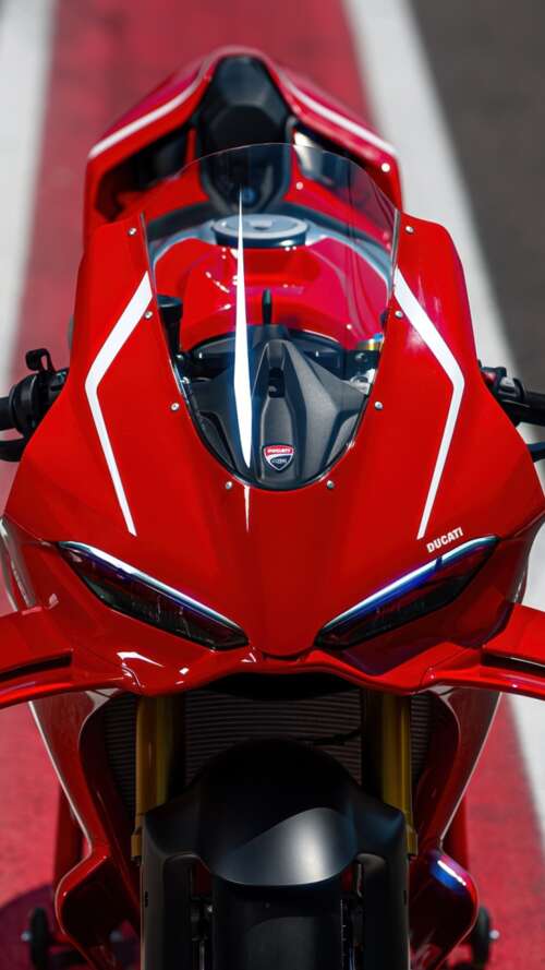 A sleek, red 2026 Ducati Panigale V4 R sports motorcycle in high detail. Apple iPhone SE 2022 pictures for wallpaper