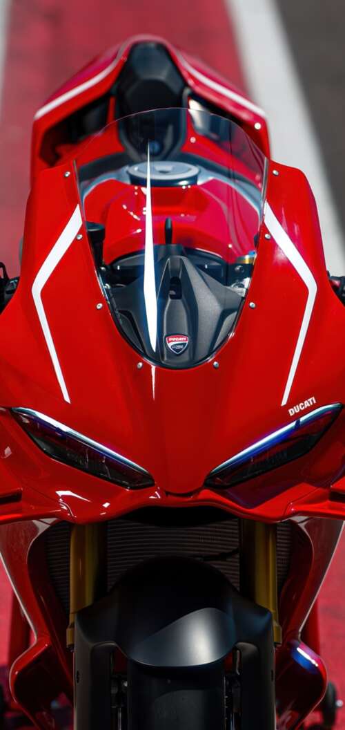 A sleek, red 2026 Ducati Panigale V4 R sports motorcycle in high detail. Oppo A6k 4G free hd wallpapers