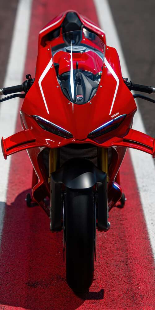 A high-detail view of a red 2026 Ducati Panigale V4 R sports motorcycle featuring... Ulefone Rugking 2 Pro wallpaper images