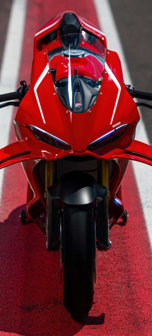 A high-detail view of a red 2026 Ducati Panigale V4 R sports motorcycle featuring... Huawei Pura 90 Pro free wallpaper