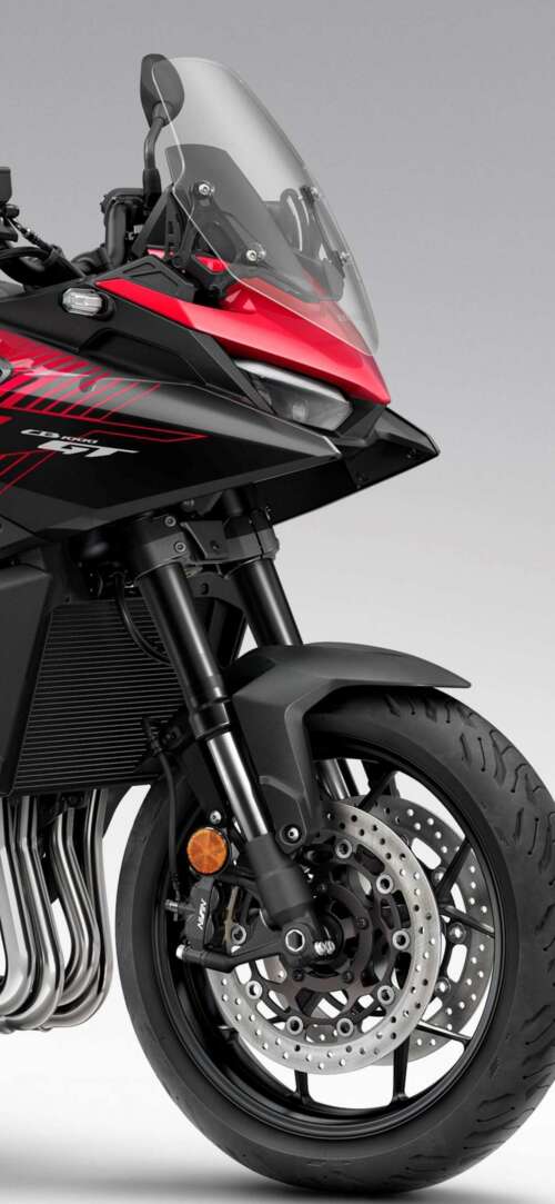 A high-resolution, cinematic view of the futuristic 2026 Honda CB1000GT touring motorcycle. Xiaomi Redmi 15 4G background images hd