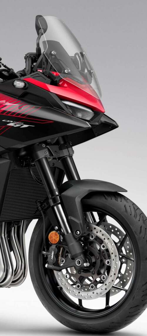 A high-resolution, cinematic view of the futuristic 2026 Honda CB1000GT touring motorcycle. Blackview XPLORE 1 Pro hd background