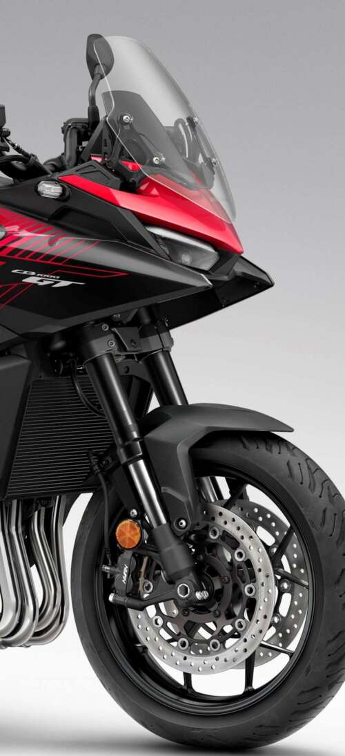 A high-resolution, cinematic view of the futuristic 2026 Honda CB1000GT touring motorcycle. realme GT 7T wallpaper download