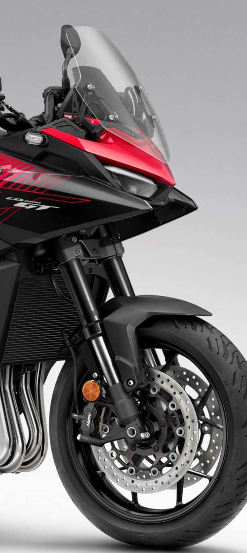 A high-resolution, cinematic view of the futuristic 2026 Honda CB1000GT touring motorcycle. Vivo iQOO Z10 Turbo cell phone backgrounds free