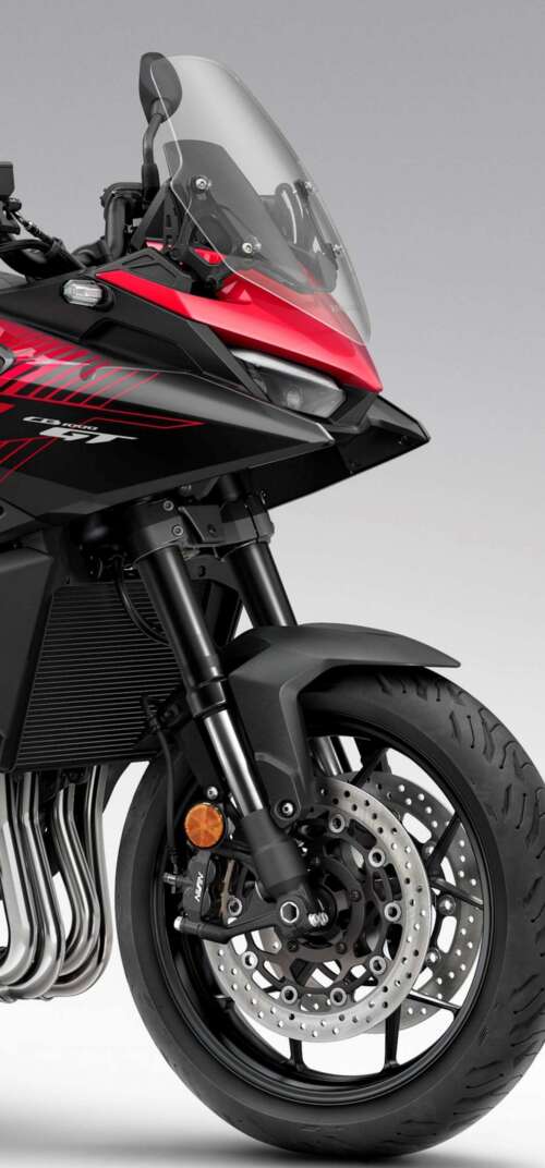 A high-resolution, cinematic view of the futuristic 2026 Honda CB1000GT touring motorcycle. Samsung Galaxy S26 Ultra free background