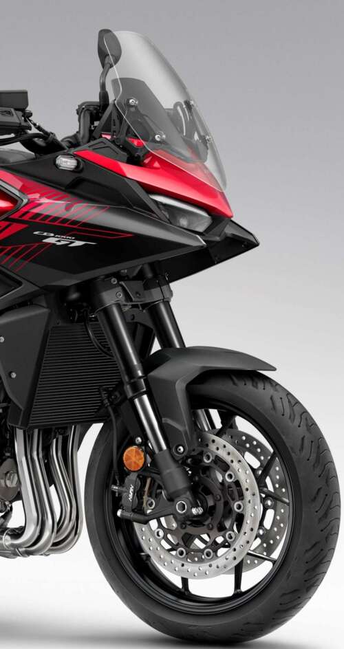 A high-resolution, cinematic view of the futuristic 2026 Honda CB1000GT touring motorcycle. Sharp Aquos C10 hd background