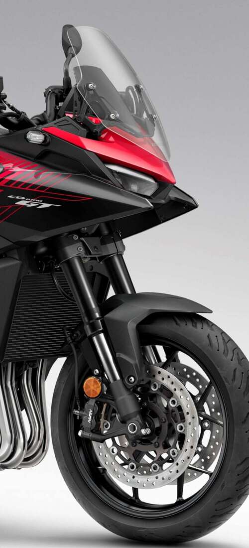A high-resolution, cinematic view of the futuristic 2026 Honda CB1000GT touring motorcycle. Oppo Find X9 wallpaper