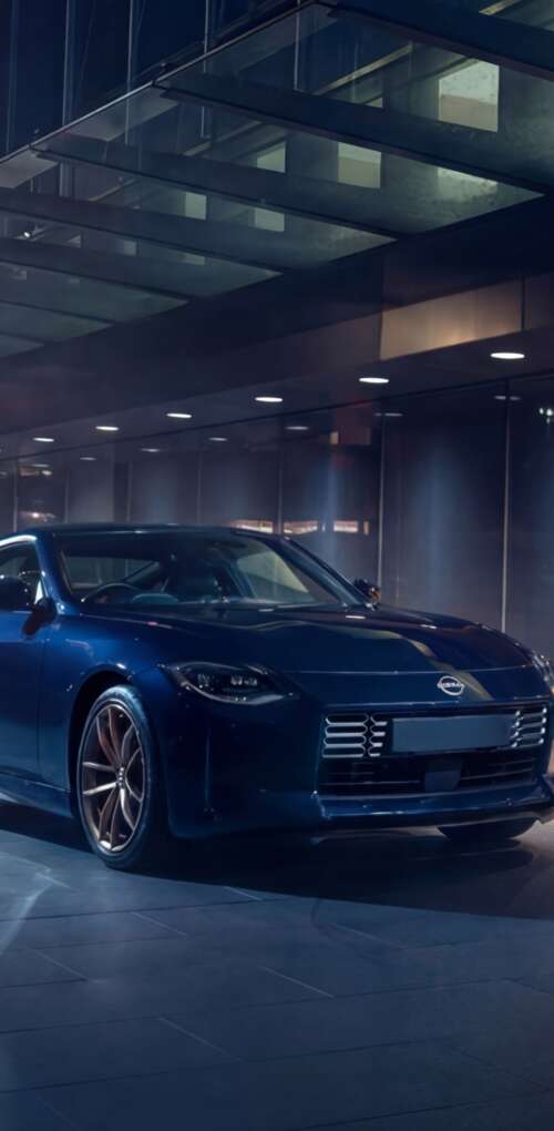 A sleek and detailed view of the 2026 Nissan Z Heritage Edition sports car. Huawei Mate 30 Pro wallpaper download