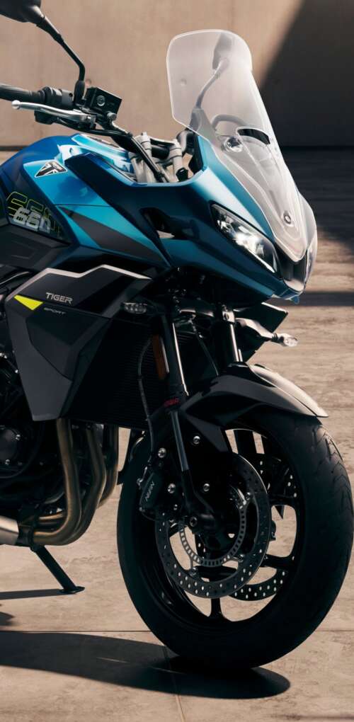 Close-up view of the 2026 Triumph Tiger Sport 660 adventure touring motorcycle Huawei Mate 30 Pro hand phone wallpaper