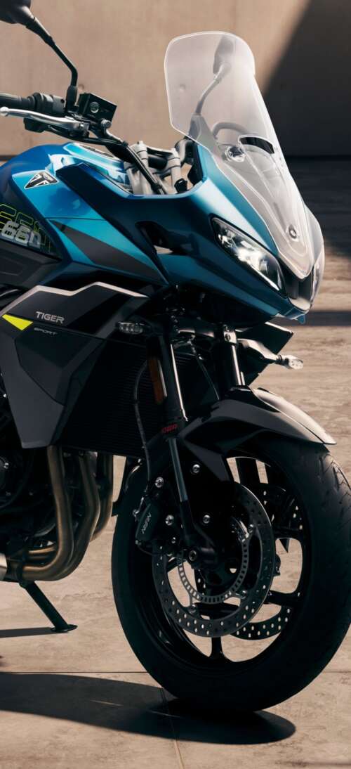 Close-up view of the 2026 Triumph Tiger Sport 660 adventure touring motorcycle realme GT 7T hd background