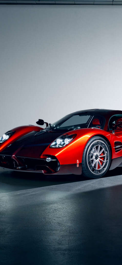 A high-performance red Pagani Utopia hypercar featuring sleek aerodynamic lines and... cell phone backgrounds free